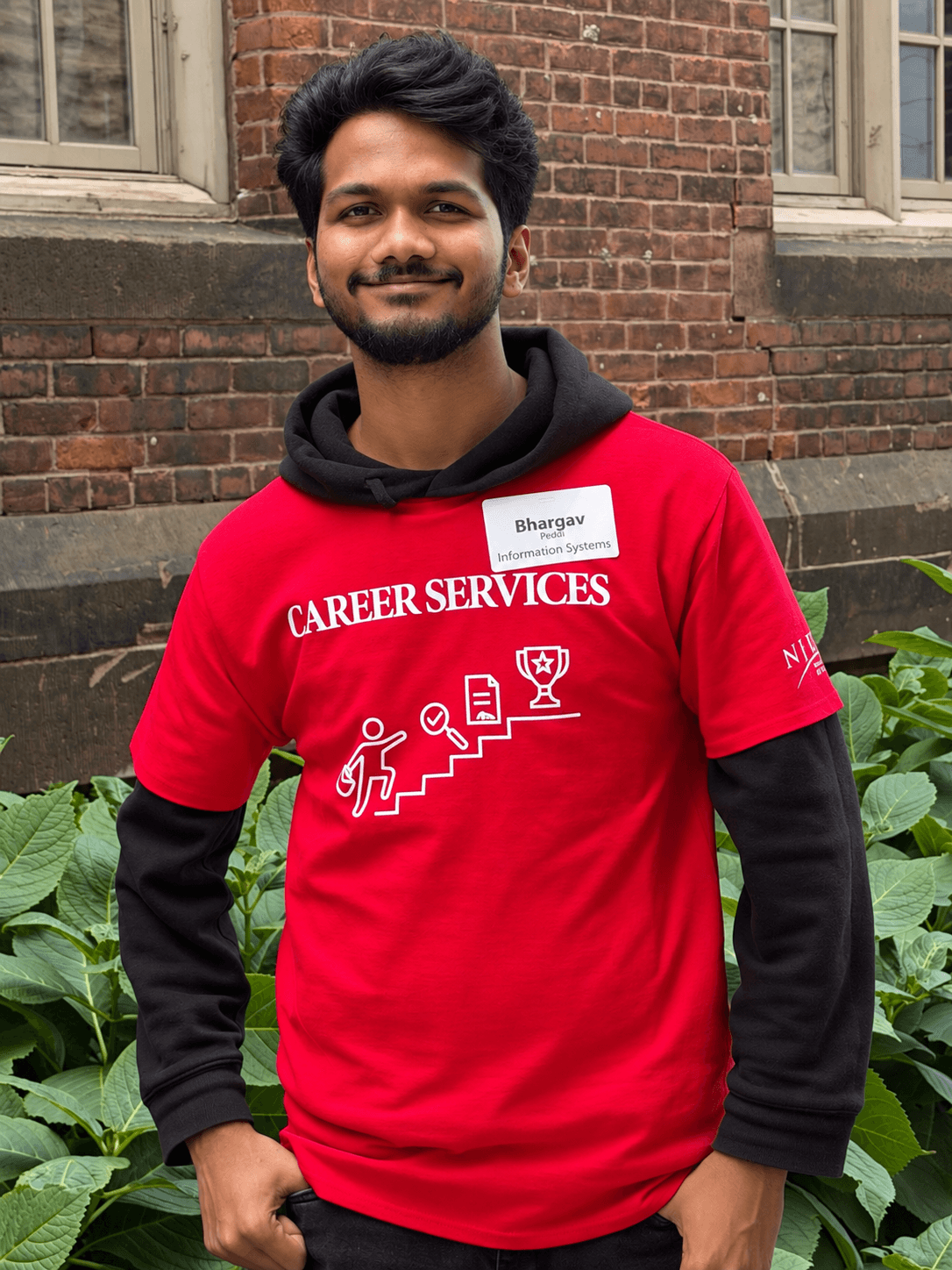 Bhargav volunteering with NJIT Career Services, wearing his red volunteer shirt